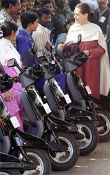 Congress President Sonia Gandhi has a word with the beneficiaries of the motorised tri-wheelers distributed by the Rajiv Gandhi Foundation on the occasion of World Disabled Day in New Delhi on Friday.
