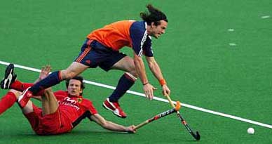 Netherlands Timme Hoyun is tackled by Germanys Benedikt Sperling  during a practice match in Lahore