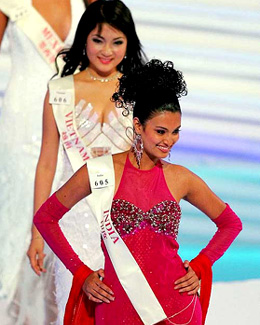 Miss India Sayali Bhagat and Miss Vietnam Huyen Nguyen Thi parade on stage during a rehearsal for the 54th Miss World Contest in Sanya