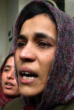 Relatives mourn the death of four members of a family at Shalteng, near Srinagar, on Saturday. 