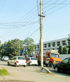 A broken pole with hanging wires in the Model Town area poses a threat to human lives in Ludhiana