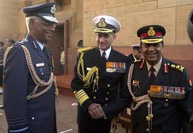 The chiefs of the armed forces, Air Chief Marshal S. Krishnaswamy, Admiral Arun Prakash and Gen N.C. Vij, share a light moment at Amar Jawan Jyoti on the 34th Navy Day in New Delhi