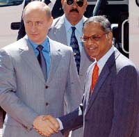 Russian President Vladimir V Putin (Left) shakes hand with chief mentor Infosys Technologies Narayana Murthy (right) on Infosys campus in Bangalore on Sunday. Putin has urged Indian computer software firms to set up offices and joint ventures in his country, promising tax breaks and government support.