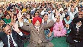 Members of the Chandigarh Housing Board Resident Federation at a rally held in support of their demands in Sector 45, Chandigarh, on Sunday