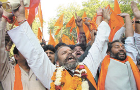 Activists of Shiv Sena party clamouring for the construction of Ram temple, on the anniversary of Babri Masjid demolition in the Capital on Monday