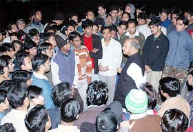 Prof R.S. Nirjhar, NIT chairman, listens to students during his visit to the institution in Hamirpur