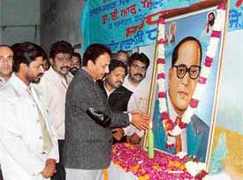 MC Commissioner S.K. Sharma pays tributes to Dr B.R. Ambedkar at a function in Ludhiana on Monday