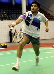 Indias No.4 ranked player Sachin Ratti plays a return shot to Pakistan Punjabs Zeeshan Umer during the Indo-Pak Punjab Games at the multipurpose indoor hall in Patiala 