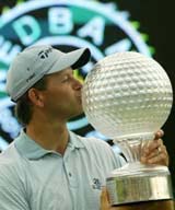 South Africas Retief Goosen kisses the Nedbank Golf Challenge Trophy at Sun City, South Africa