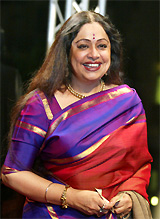 Indian actress Kiran Kher arrives at the opening of the first Dubai International Film Festival at the Madinat Arena in Dubai on Monday