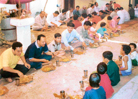 Those who eat together, stay together. Himachalis eating a community meal at a wedding