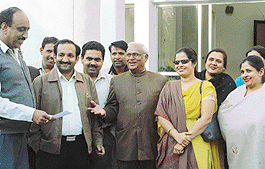 Congress and BJP councillors stand outside the MC office in Panchkula on Wednesday.
