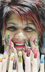 Pammy Kaul, nail artist and beautician, displays her art at a saloon in Chandigarh on Wednesday.