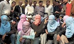 The gangsters with the seized motorcycles