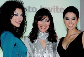Indian models strike a pose at the press meet of The 2005 Singapore Fashion Festival in New Delhi on Thursday.