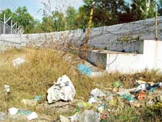 The stadium gives a look of a haunted place with its outer walls and the stands littered with garbage.