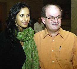 British writer Salman Rushdie and his model-actress wife Padma Lakshmi pose for photographers at a hotel in Kolkata on Wednesday. 