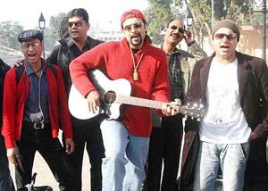 Members of Pakistani music group Junoon pose after crossing over to India through Wagah joint check-post