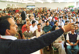 An employee of the Estate Office seeks bids for the auction of residential property in Chandigarh on Friday.