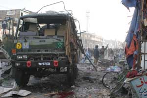 A damaged army truck is seen at the bomb blast site in Quetta on Friday. 