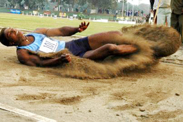 Indian Punjabs Amritpal Singh lands in the pit at the 6.64m mark, which won him the gold medal in the mens long jump event, during the first Indo-Pak Punjab Games in Patiala on Friday.