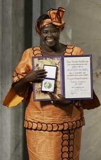 Wangari Maathai poses with Nobel Diploma and the medal after receiving the 2004 Nobel Peace Prize during a ceremony in Oslos City Hall on Friday