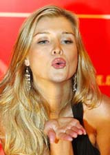 Polish-born top model Joanna Krupa blows a kiss