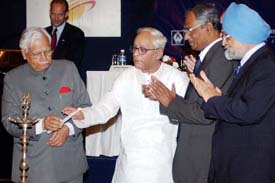 Deputy Chairman of Planning Commission Montek Singh Ahluwalia claps during the inauguration of WBIDC