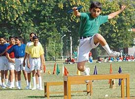 Children of Stepping Stones School, Sector 38, Chandigarh, take part in athletics events during the annual sports day of the school held on Saturday. 