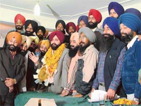 Mr Kanwaljit Singh Dua, district president of the Shiromani Youth Akali Dal, with party workers on his nomination as national general secretary of the party