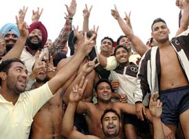 Members of the Punjab  team rejoice after winning the circle kabaddi match against Pakistan Punjab at the polo ground in Patiala on Saturday