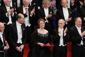 Linda B. Buck of the USA acknowledges the applause of her fellow laureates after receiving the Nobel Prize in Medicine