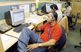Employees at the Wipro Spectramind call center, which services customers of a US-based computer manufacturer and an Internet service provider in Britain, work during the night shift. 