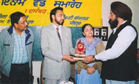 Jagjit Singh Jajjie (turbaned), who has set a record of donating blood 133 times, was honoured by Mr Hussan Lal, DC, Sangrur, at a function held at Mandi Ahmedgarh