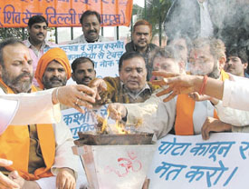Shiv Sainiks participating in a yagna to pay homage to those killed by terrorists, on the anniversary of attack on Parliament, at Jantar Mantar in the Capital. 