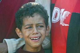 An Israeli boy mourns during the funeral of Israeli soldier Tarek El Zayati in the Israeli town of Rahhat