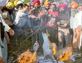 Members of the Punjab Government Transport Workers Union (AITUC), protest at Tribune Chowk in Sector 29, 