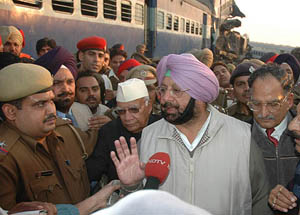 Chief Minister Amarinder Singh enquires about the fate of passengers at the accident site in Mansar village near Mukerian on Tuesday. 