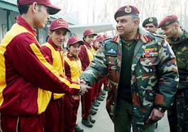 The GOC, Lieut-Gen Nirbhay Sharma, with a group of Kashmiri children