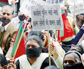 BJP activists wear black strips at a demonstration held near the Mini Secretariat in Ludhiana on Tuesday