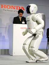 Honda Motors humanoid robot, next-generation Asimo, runs at Hondas office in Wako, north of Tokyo, on Wednesday.