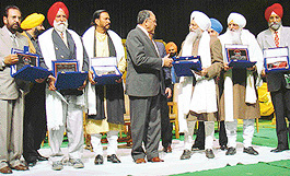 Punjab Governor Gen S.F. Rodrigues (retd) congratulates this years Punjab Sangeet Natak Akademi awardees who were honoured at a special function held at Tagore Theatre on Wednesday.