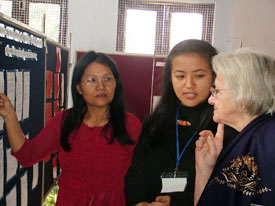 Lalhmasai and Lynda, faculty members from Mizoram University, explain a point to a foreign delegate at the poster session during an international conference on womens issues at HAU in Hisar on Wednesday