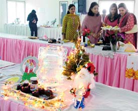 Judges have a look at the participants’ preparations during a cookery contest at the Luxmi Ladies Club in Ludhiana
