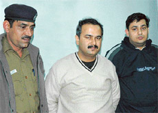 Cossets directors Punit Nanda and Rajiv Dugala in police custody at the Economic Offences Wing at Sector 17, police station, Chandigarh, on Thursday. 