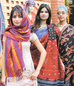 Models exhibit classic handloom shawls during an exhibition Shawl Show 2004 which was inaugurated by R. Poornalingam, Secretary, Textiles, at Pragati Maidan in the Capital on Friday. 