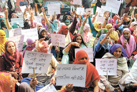 Women from villages under the banner of Delhi Grameen Vikas Panchayat protesting against the house tax in rural areas at Jantar Mantar in the Capital on Friday. 