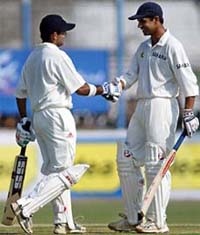 Rahul Dravid congratulates Gautam Gambhir on completing a century against Bangladesh on the first day of the second Test in Chittagong