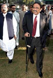 Asif Ali Zardari, husband of Pakistan's former Prime Minister Benazir Bhutto, with his supporters arrives at the Sindh High Court