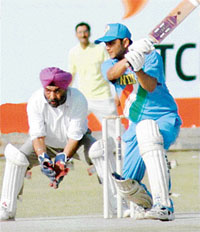Kamleshwar Singh of The Indian Express hits a four during the inter-media cricket tournament 